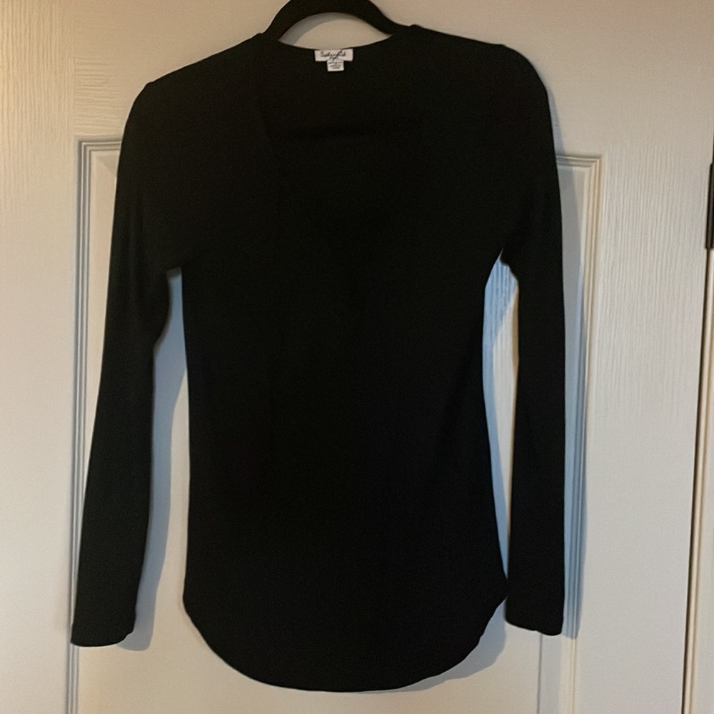 Black long sleeve top with lace up v-neck.